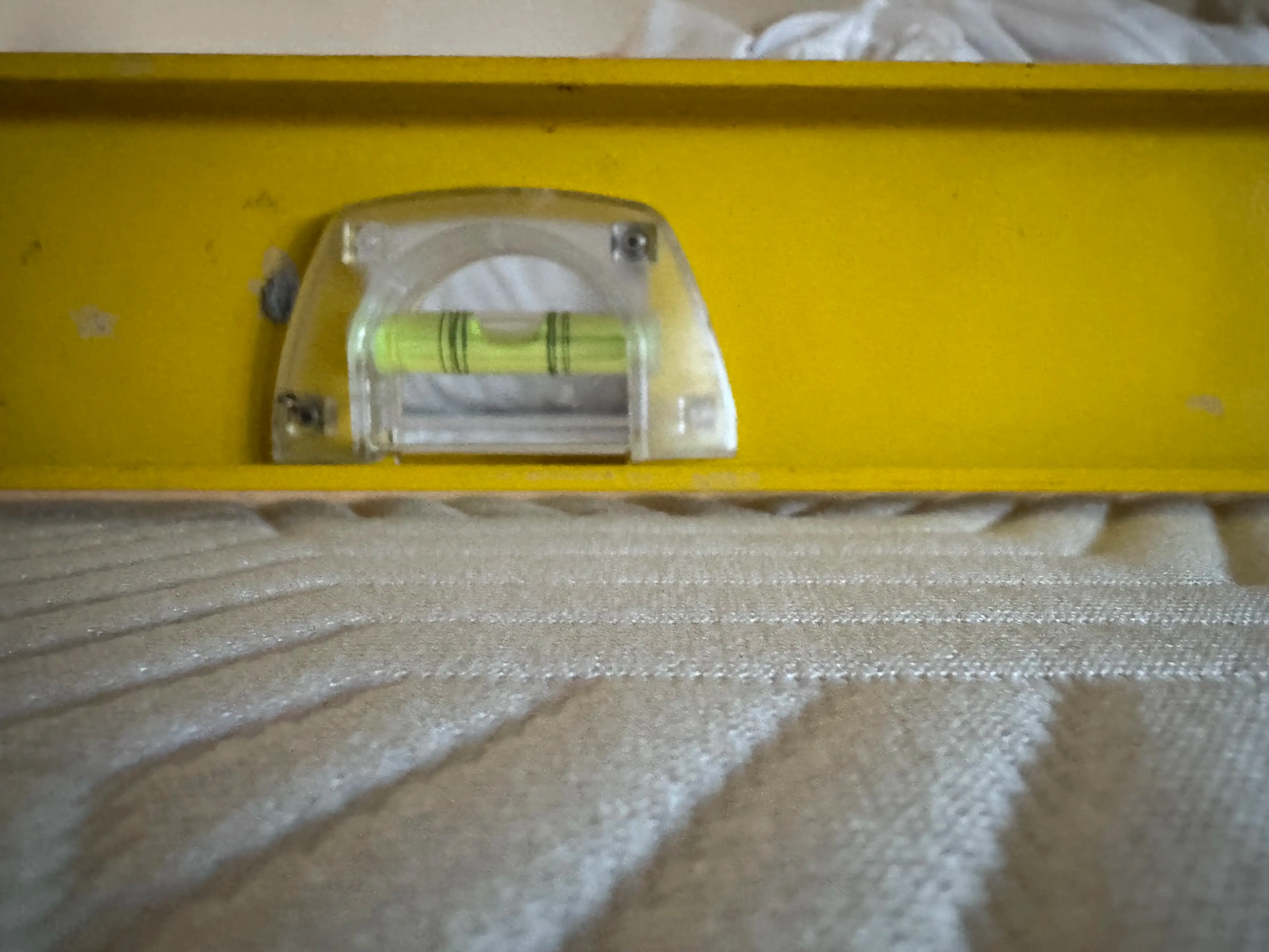 Side profile of Lucid mattress showing a soft dip forming in the middle